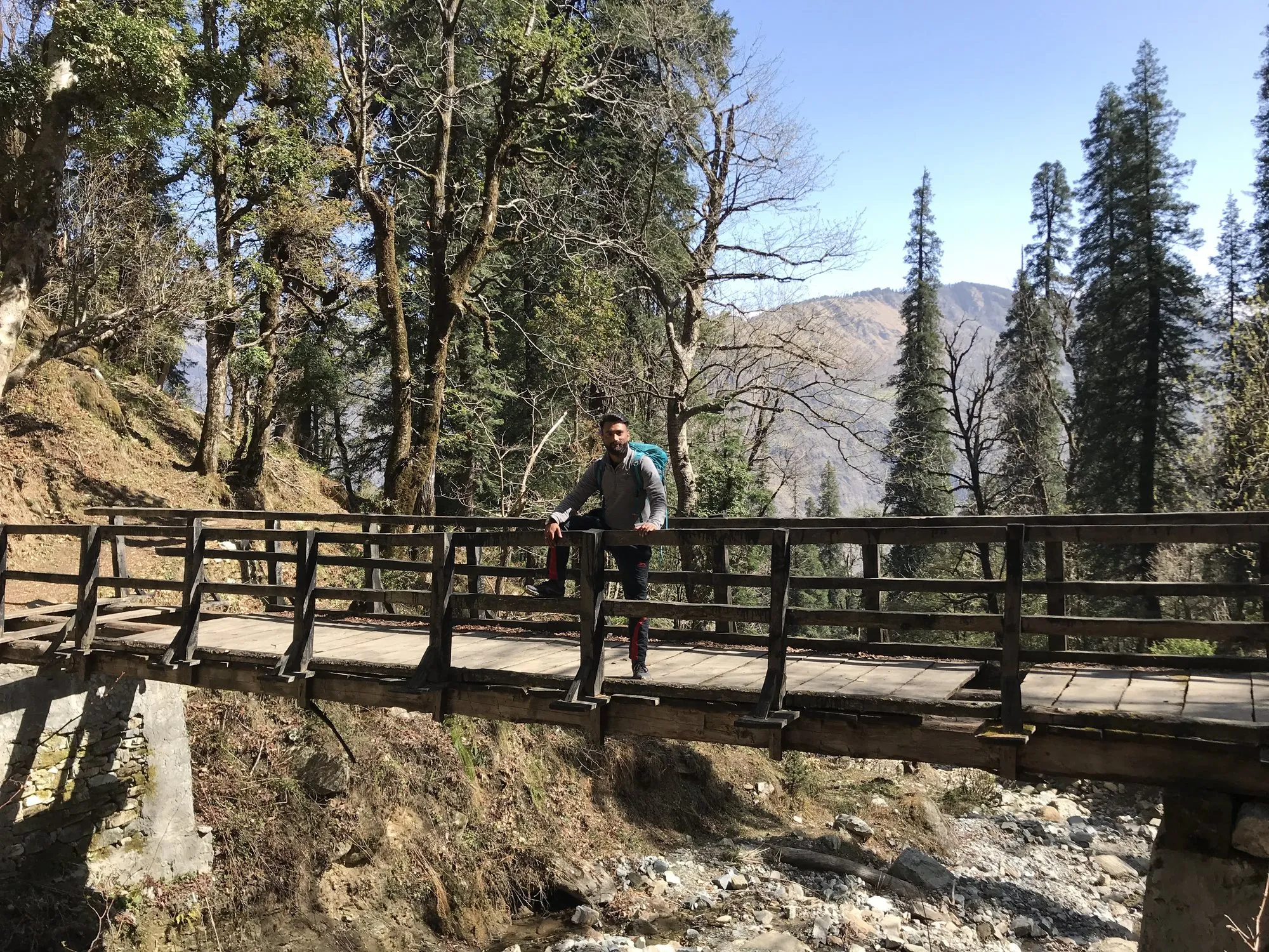 Crossing a wooden bridge on the trail