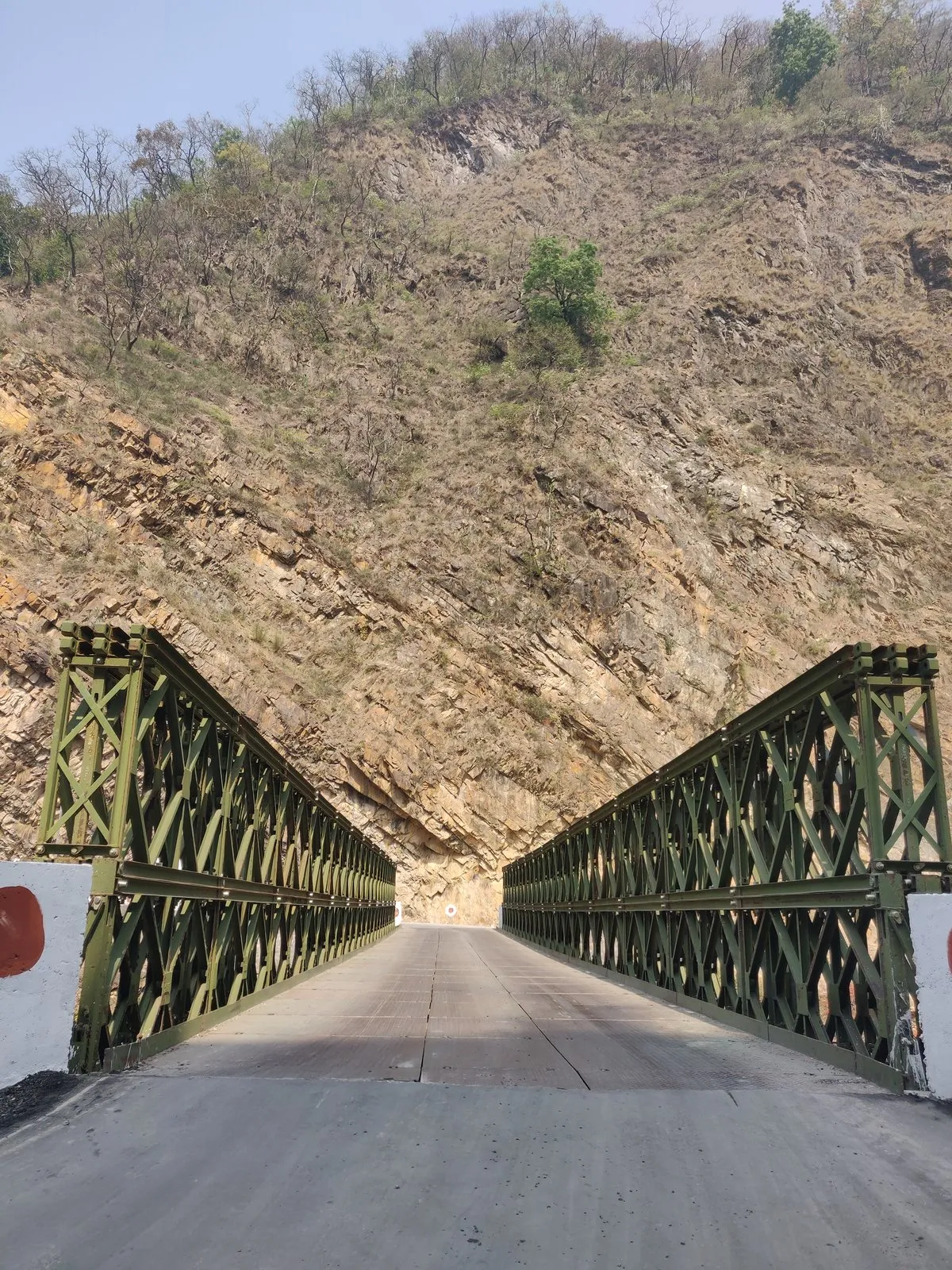 An iron bridge over the river on the way
