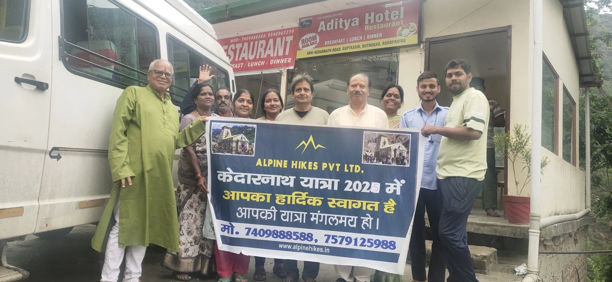 Welcoming a yatra group with the Alpine Hikes banner